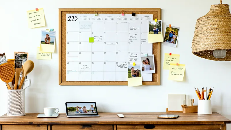 Calendar showing year 2025 with family photos and device usage notes on a family planning board